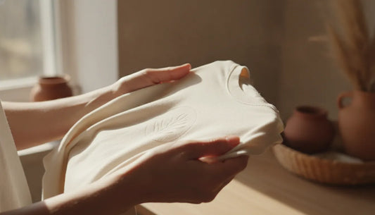 Hands holding a soft cotton t-shirt, natural lighting, sustainable fashion